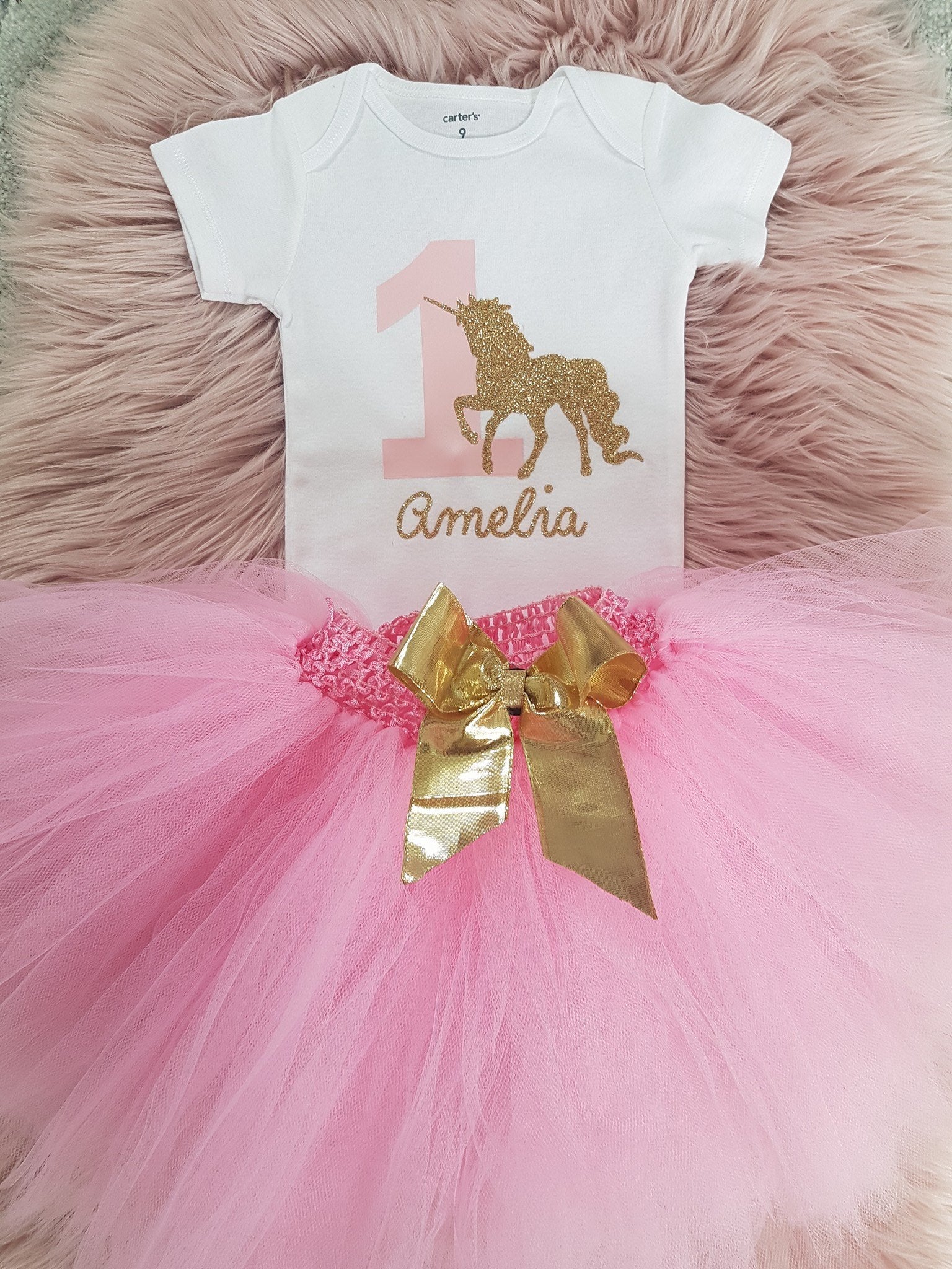 Customize your tee or onsies your way.  Here the client chose vinyl application: Glitter vinyl to bring out those gold accents for this pink and gold unicorn 1st birthday celebration. Grow with Me tutu's with removable bows are also available.
